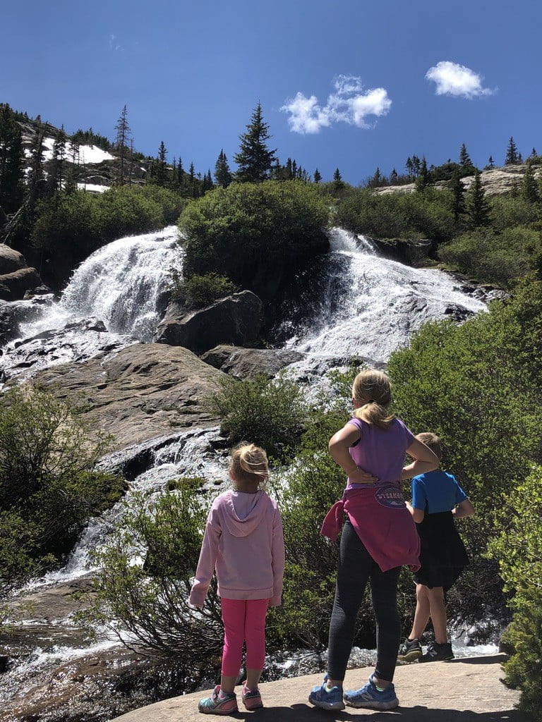 kids admiring waterfalls at McCullough Gulch trail in Breckenridge