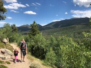 Rocky Mountain national Park Bierstadt Trail man with two daughters on trail