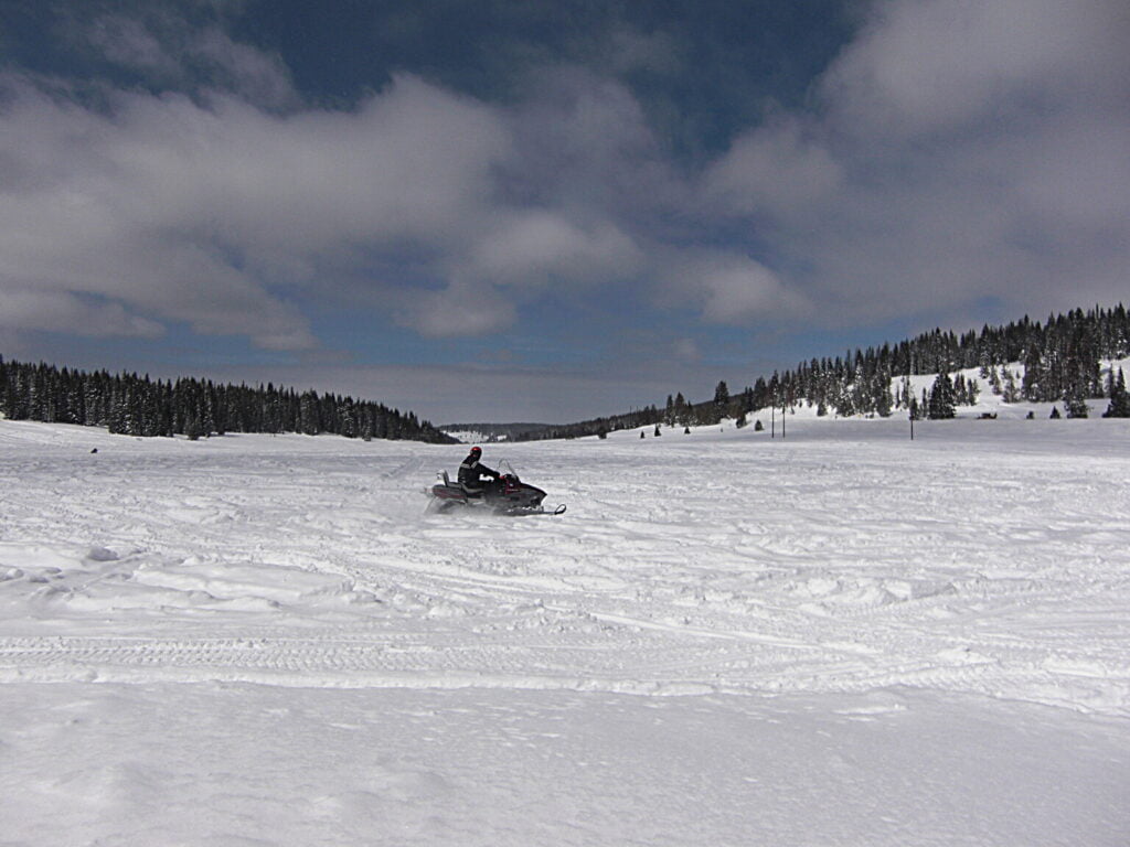 person snowmobiling in Steamboat Springs, Colorado in November