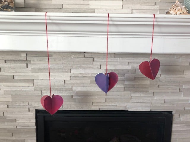 3d paper heart hanging on mantle