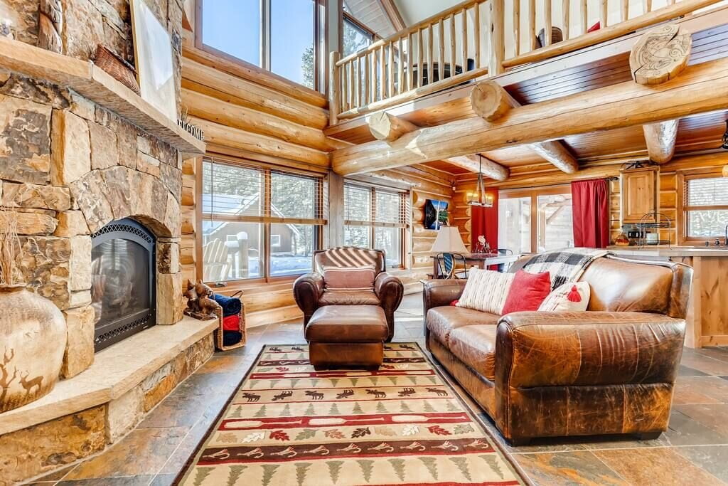 living area with large logs Rental Cabins in Breckenridge