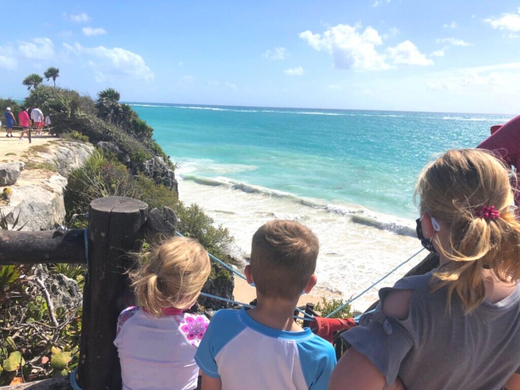kids looking out at the ocean in Tulum