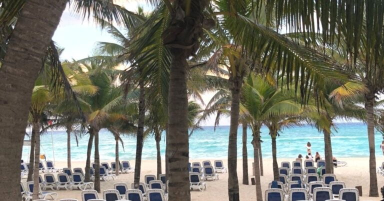 Wyndham Maya reviews blue beach chairs on white sand with blue waters