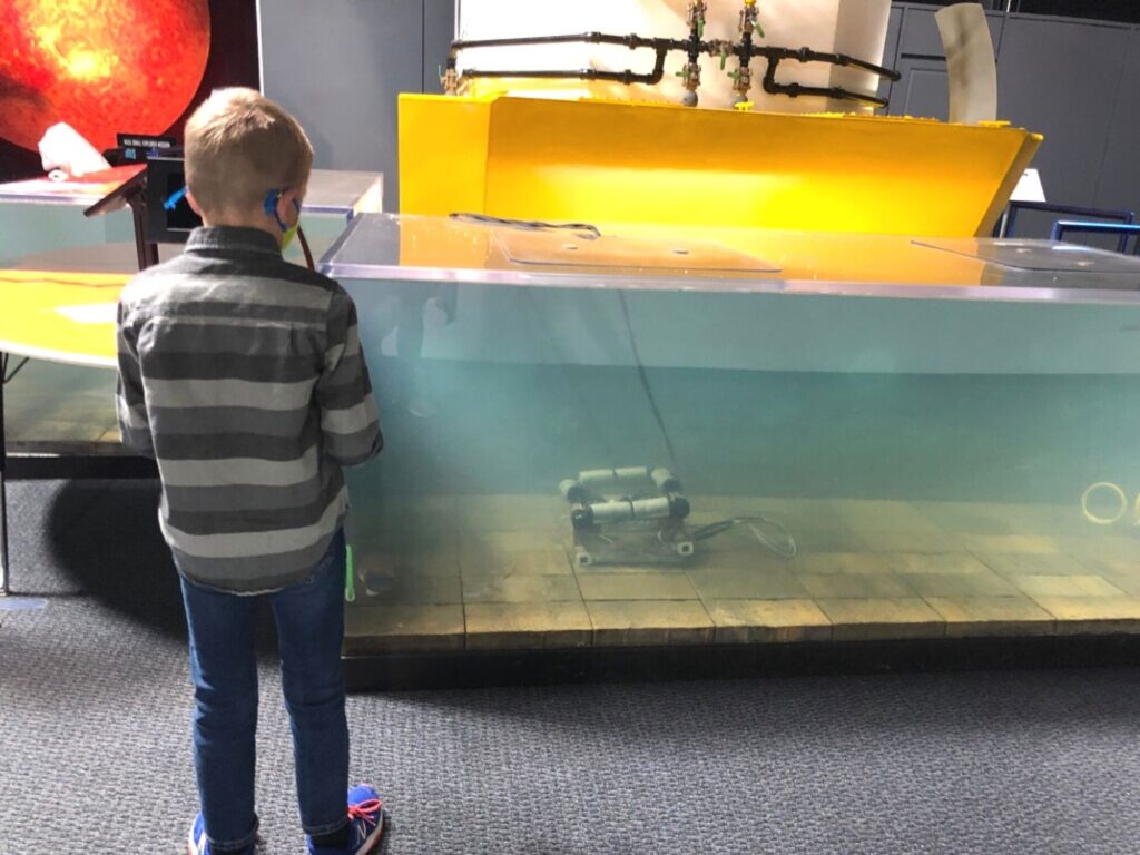 boy driving a water rover