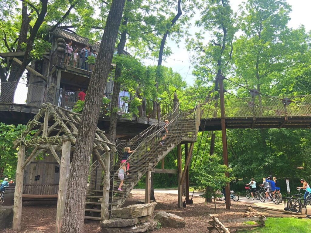 Kids playing at large tree house in Dogwood Canyon