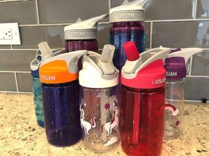 6 Camelbak water bottles in various colors