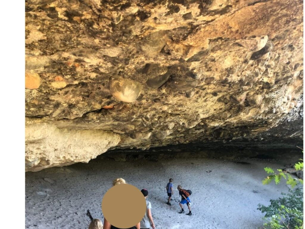 kids exploring a cave at Castlewood Canyon state park