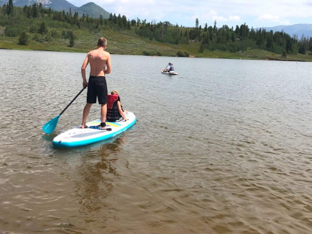 father/son paddle boarding on Steamboat Lake