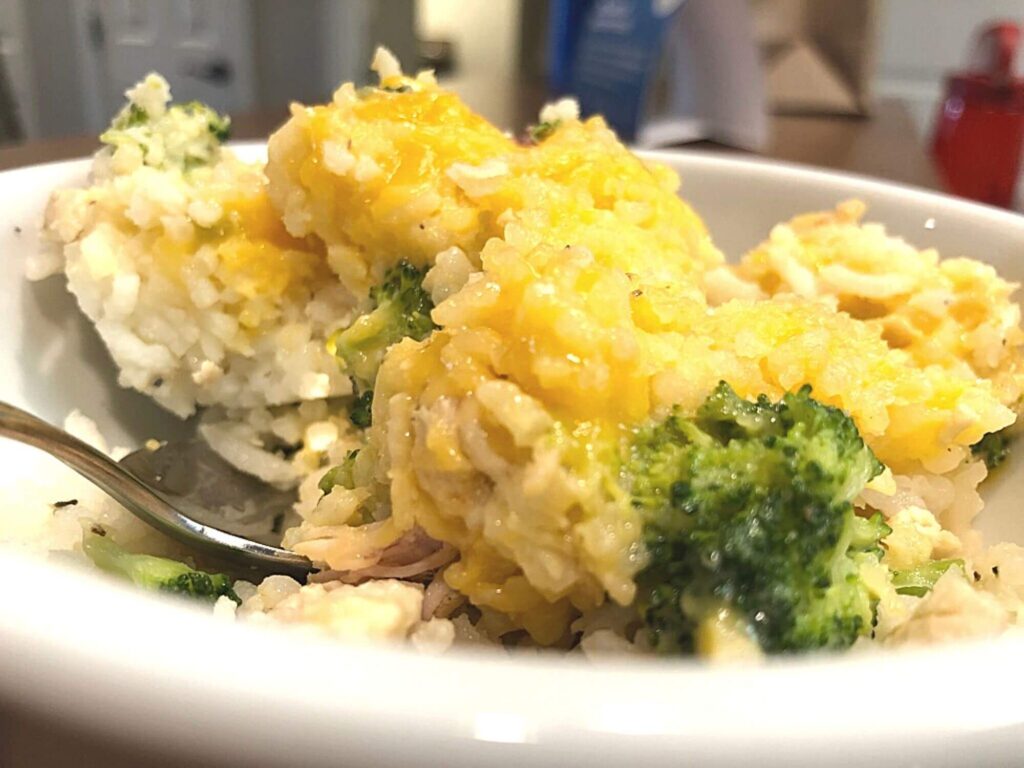cheese, broccoli, and rice in a dish