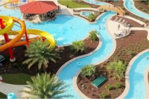 Water Park Hotels in Louisiana Seven Clans; blue lazy river, orange and yellow slides