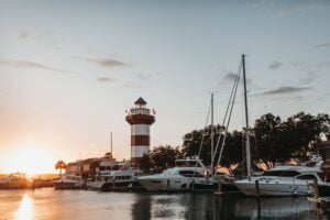 things to do in Hilton Head with kids red and white lighthouse at sunset