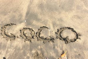 Playas del coco feature image Coco written in sand