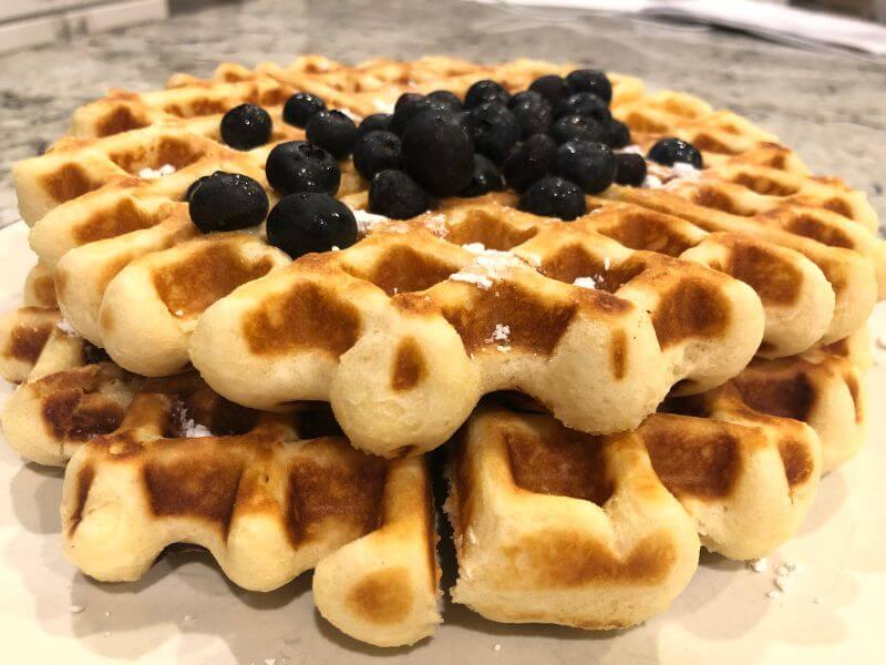 2 Belgian Waffles stacked with blueberries on top