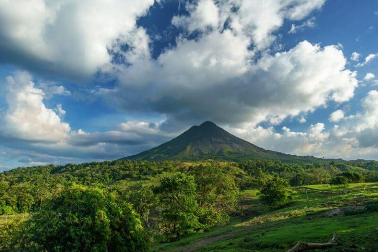Green covered land with arenal Volcano. Full of beauty, is Costa Rica a third world country?