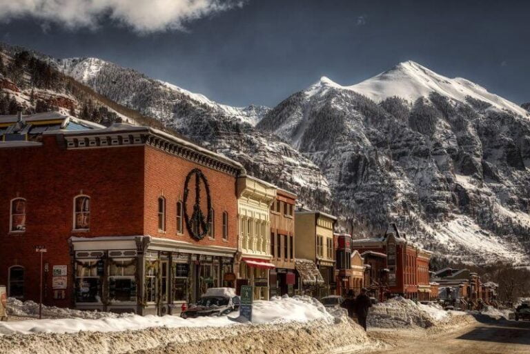 old mining town with snowy mountain behind, Telluride in winter