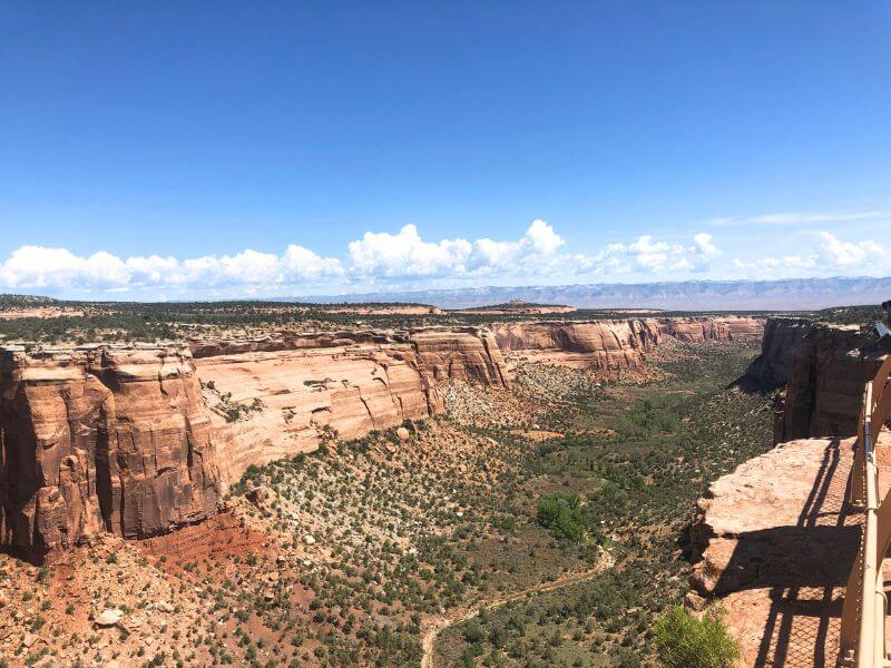 colorful canyon with steep red rock on each side