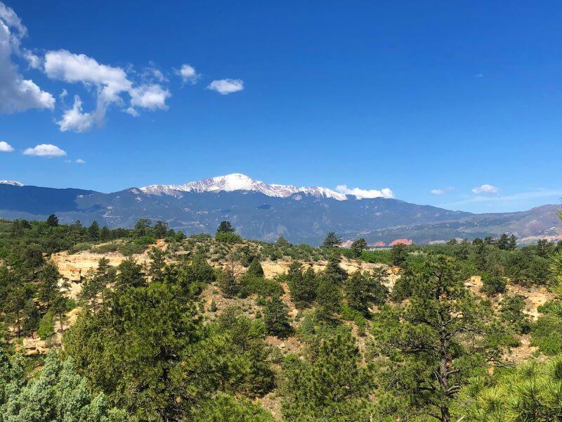 lookout to mountains with snow on them in the distance at Palmer Park