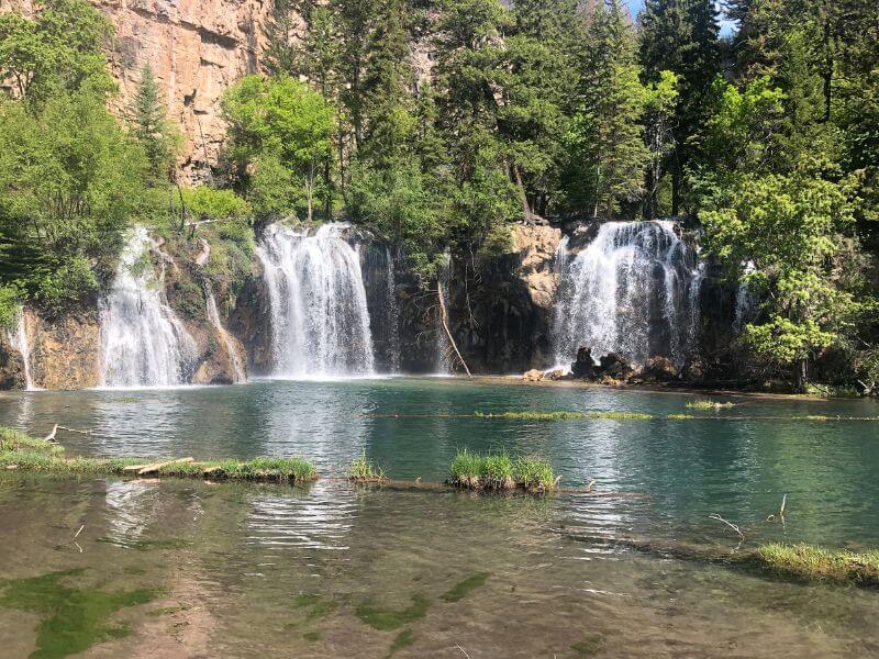 Hanging Lake, three waterfalls falling into a green water lake