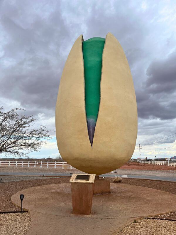 a giant, 30 foot tall pistachio. Dark cloudy skies all around