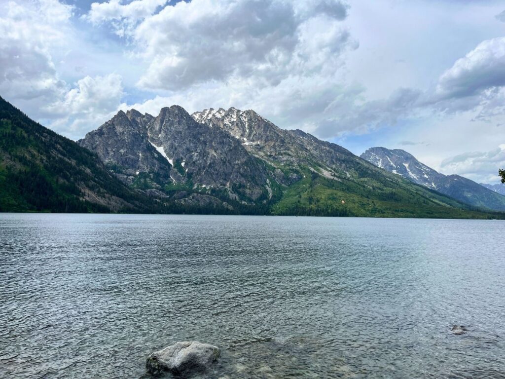 Jenny Lake in Grand Teton National Park.  Calm lake surface with mountains in background