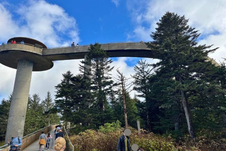a tall cement lookout tower with a path winding down from the top at Kuwohi Great Smoky Mountains