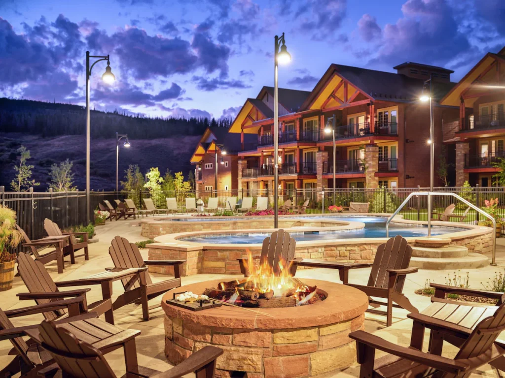 mountain hotel in Breckenridge CO.  It's lit up at night with  pool and firepit outdoors